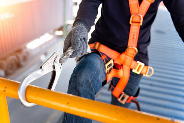 construction worker with safety harness