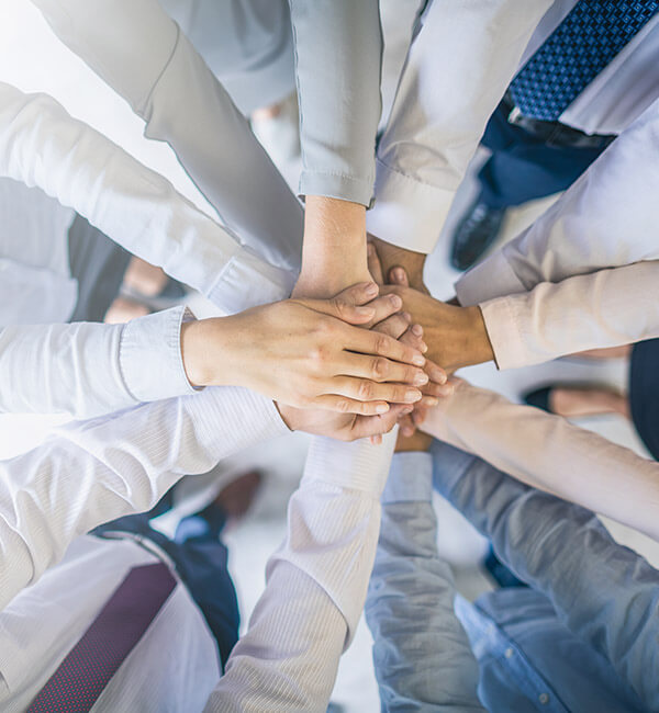 workforce management team hands stacking